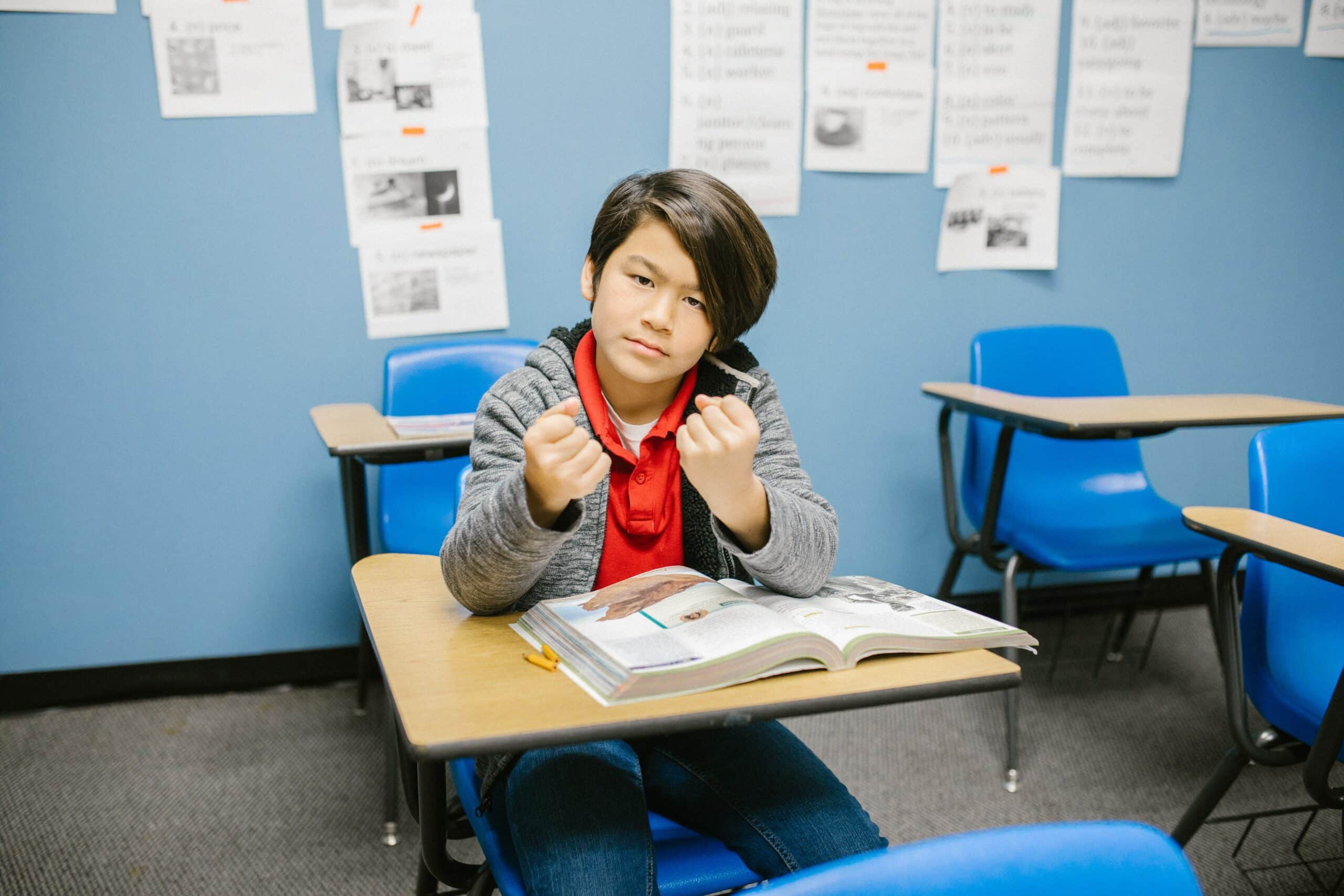 pexels-rodnae-productions-6936379 Teen with fists up
