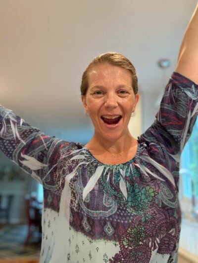 Author celebrating with arms in the air