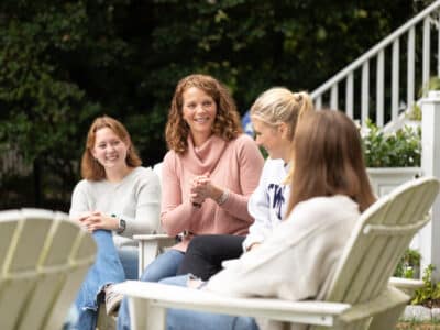 Sam speaking with three teens